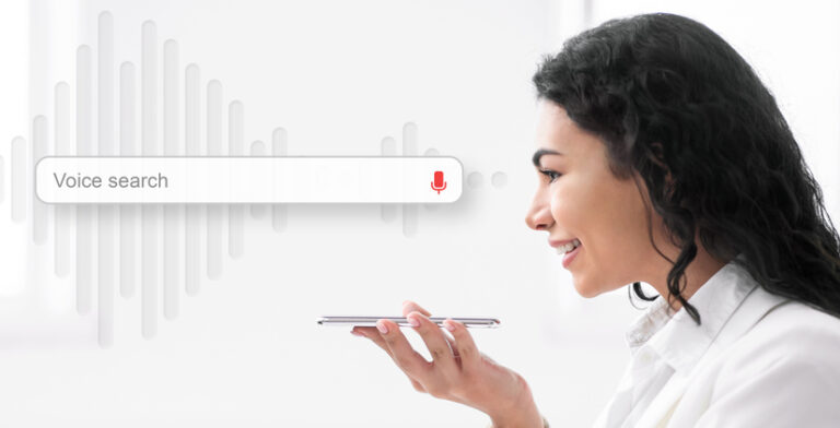 How to Optimize Your Website for Local SEO in New Orleans & Metairie – 12 Best Practices 4 Virtual Assistant. Mexican Businesswoman Using Voice Search On Mobile Phone Sitting On White Background. Panorama, Side View