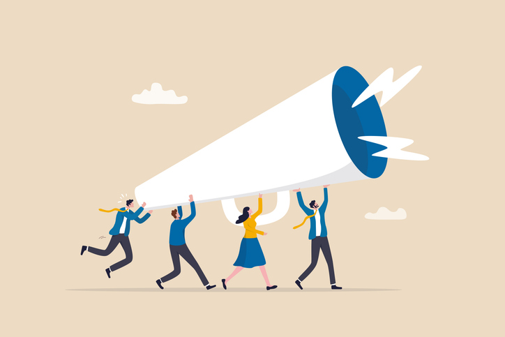 The Game-Changing Benefits of Working with a Digital Marketing Agency 2 team holds megaphone